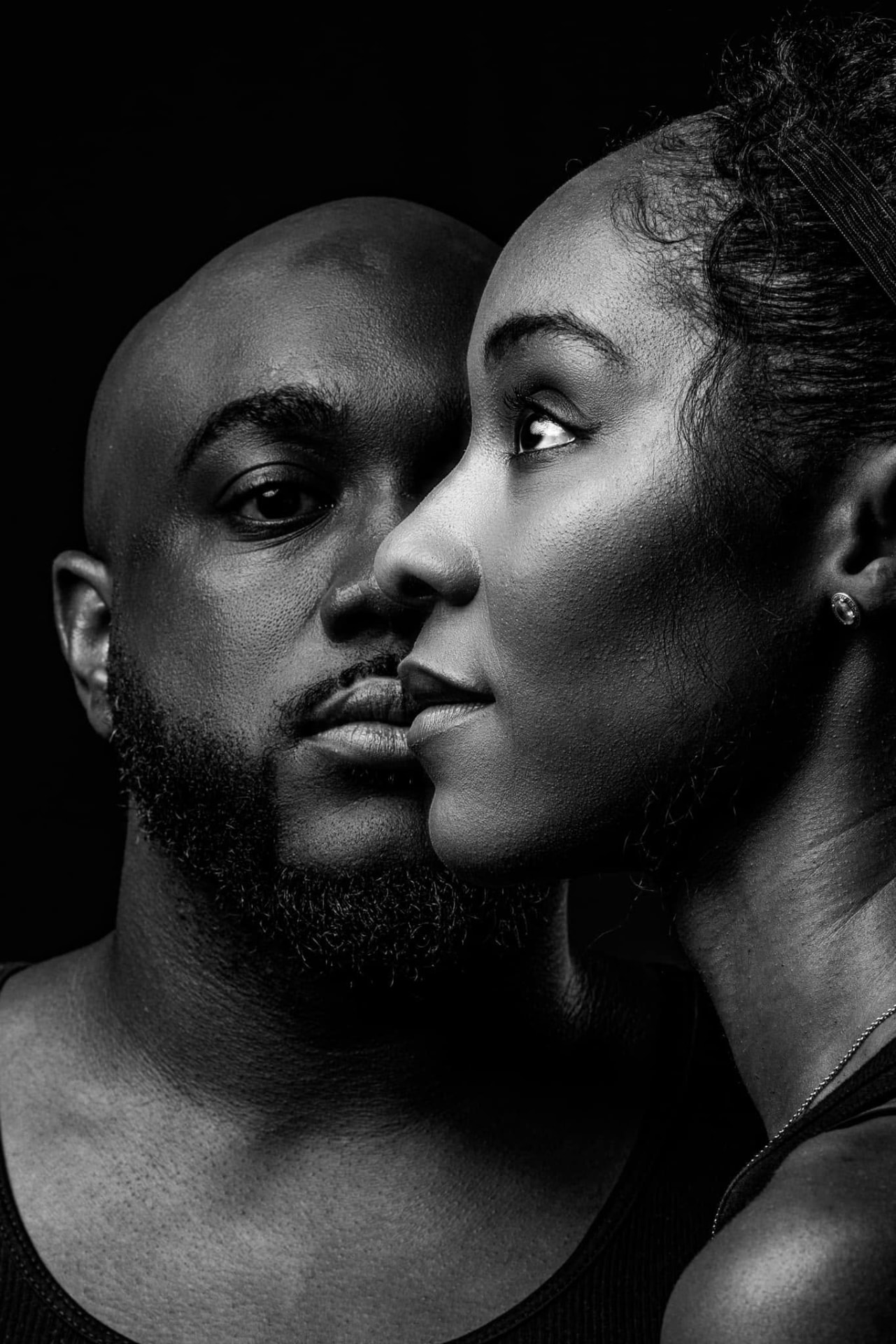 Black and white portrait of a couple, cheek to cheek — Editorial lifestyle portrait by Claudia Quiana