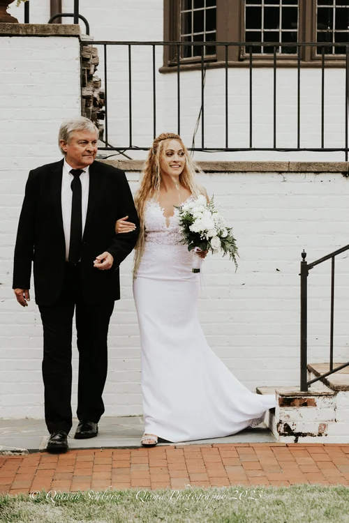 Father walking the bride down the aisle