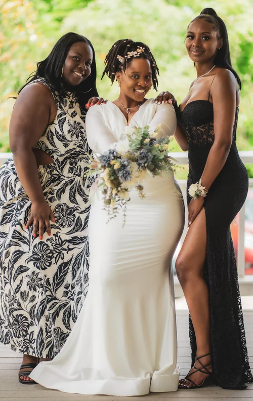 Bride with her two closest friends on the porch