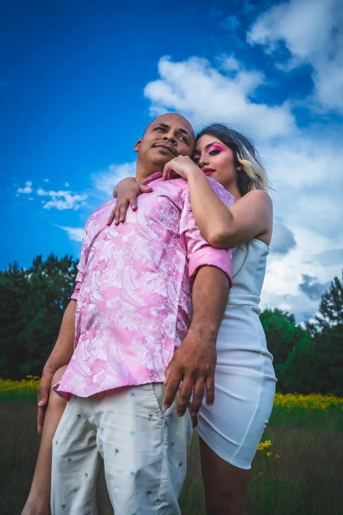 Couple embracing under a vivid blue sky